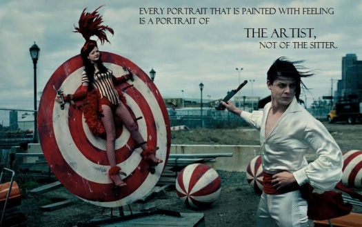Muted color photo of Meg and Jack White, of the band The White Stripes; Jack dressed in white satin jumpsuit, holding throwing knife, windblown hair; Meg wearing red and white striped circus leotard, red fishnets, heels, and feather headpiece, strapped to red and white target wheel; circus balls and construction site in background. Black text superimposed, with emphasis and divisions: "Every portrait that is painted with feeling is a portrait of / THE ARTIST, / not of the sitter.